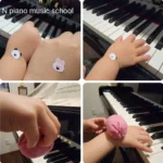 N piano music schoolの年少〜年長生徒が、ピアノ演奏時の手のフォームと身体の使い方を意識して取り組む様子。シールやお手玉を使った工夫が見られます